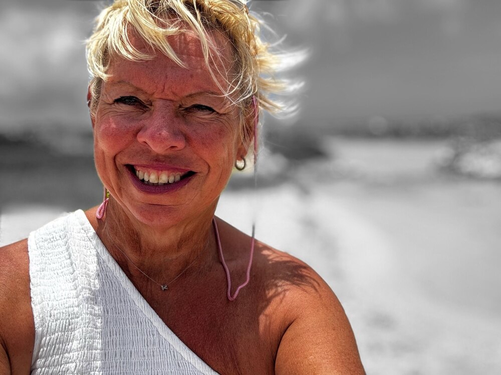 Karie Jane smiling on a beach in Fuerteventura